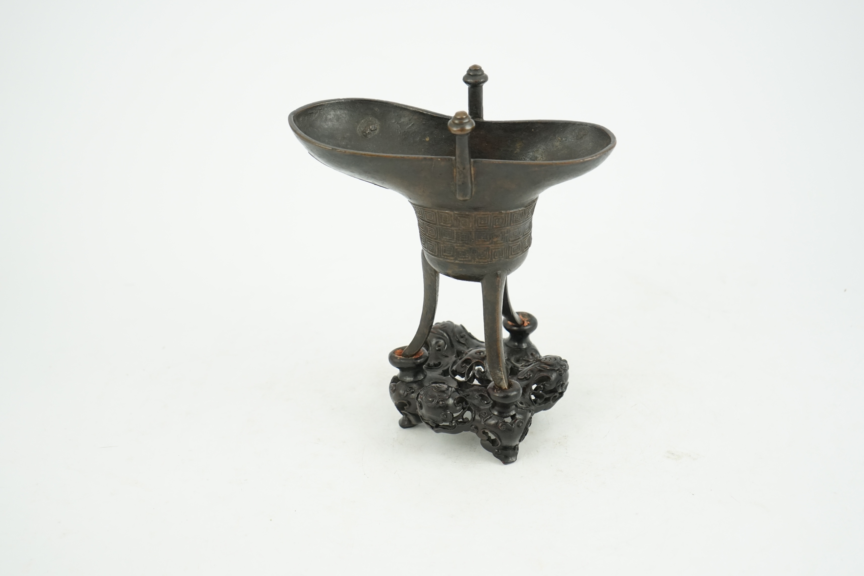 A good Chinese archaistic bronze tripod wine cup, jue, dated Qianlong 3rd year, corresponding to 1738